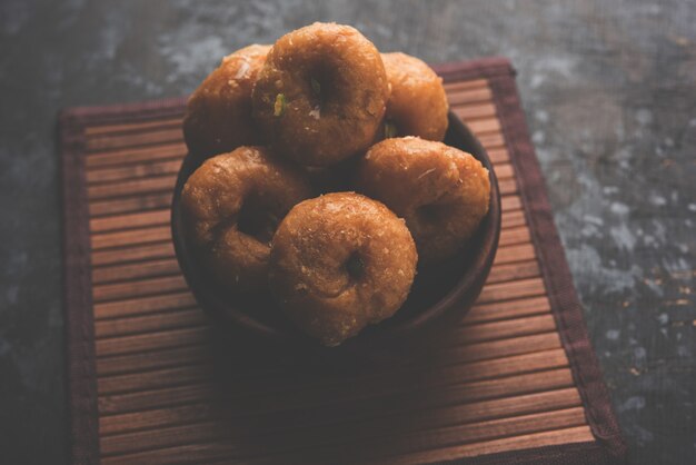 Balushahi sweet food served in a white or golden plate over moody background