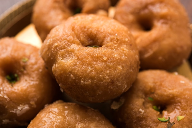 Balushahi sweet food served in a white or golden plate over moody background