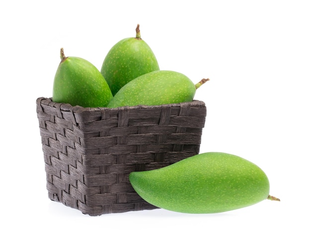 Bamboo basket of fresh mango isolated on a white background.