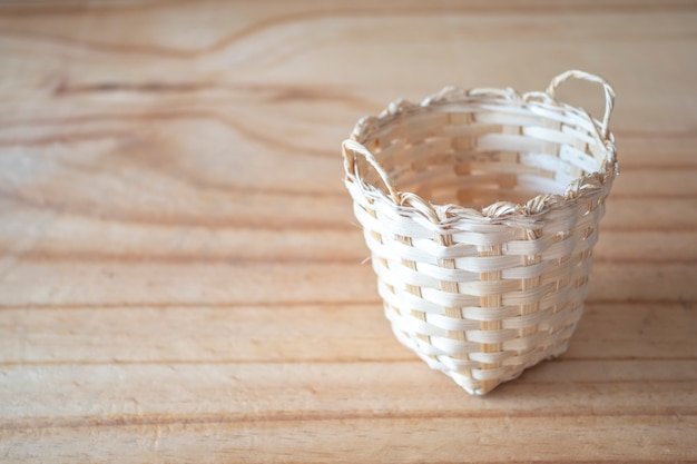 Bamboo basket on wooden texure