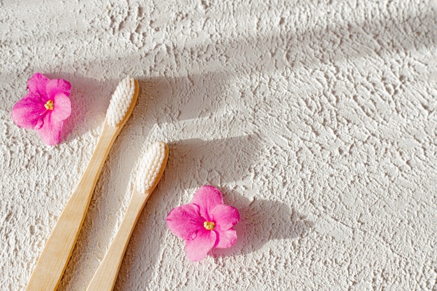 bamboo brushes on a white surface copy space. concern for the environment. toothbrush. 