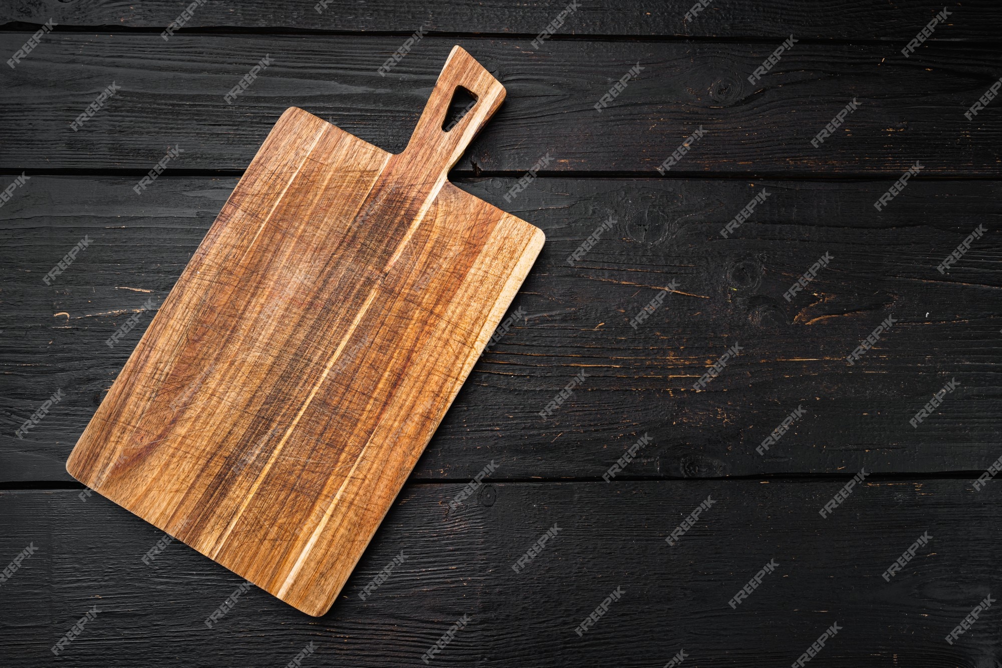 Premium Photo  Empty round kitchen wooden cutting board in brown color on  a dark textured concrete background