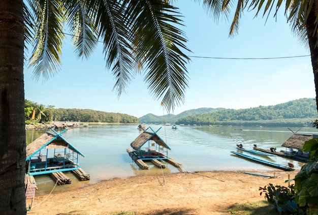 Bamboo raft floating on lake in summer