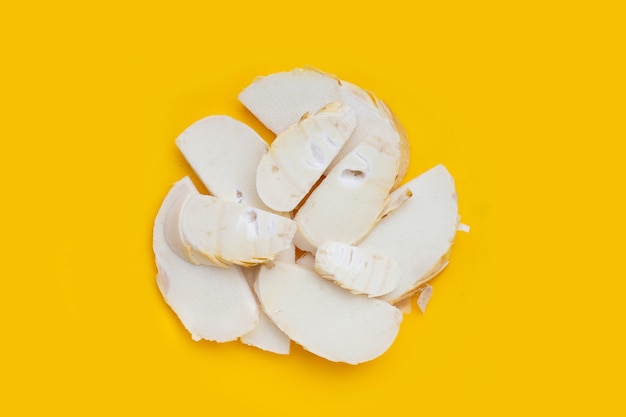 Bamboo shoots on yellow background.