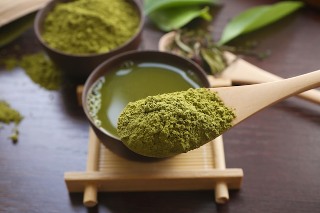 Bamboo spoon with powdered matcha tea closeup