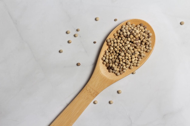 Bamboo spoon with white pepper