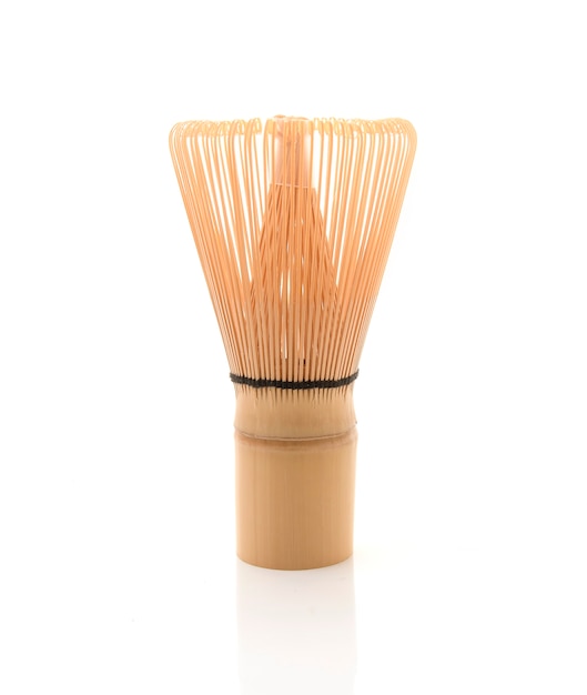 Bamboo tea whisk for matcha on white background, traditional culture of Japanese matcha tea