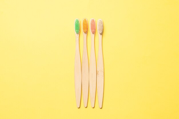 Bamboo toothbrush on a blue background. Top view.