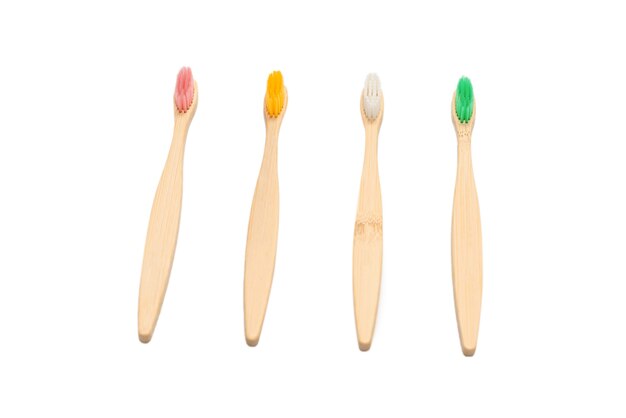 Bamboo toothbrush isolated on a white surface. Top view.