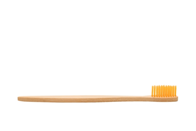 Photo bamboo toothbrush isolated on a white surface. top view.