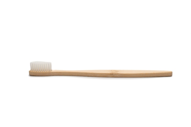 Bamboo toothbrush isolated on a white surface