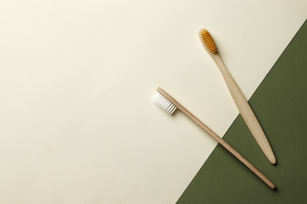 Bamboo toothbrushes on pink background