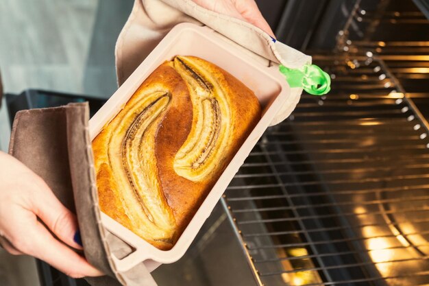 Photo banana bread in the oven cooking homemade food selective focus