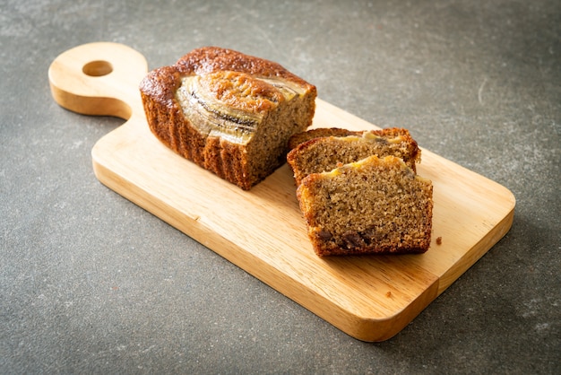 banana cake sliced on wood board