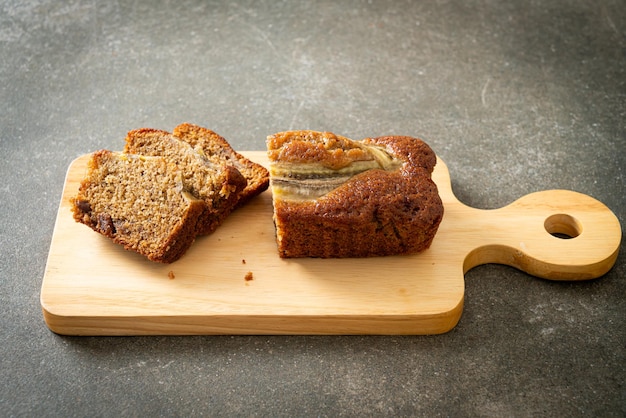 banana cake sliced on wood board