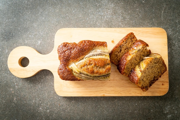 banana cake sliced on wood board