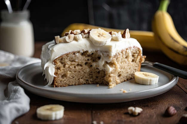 Banana cake with cream cheese frosting and fresh banana slices on top