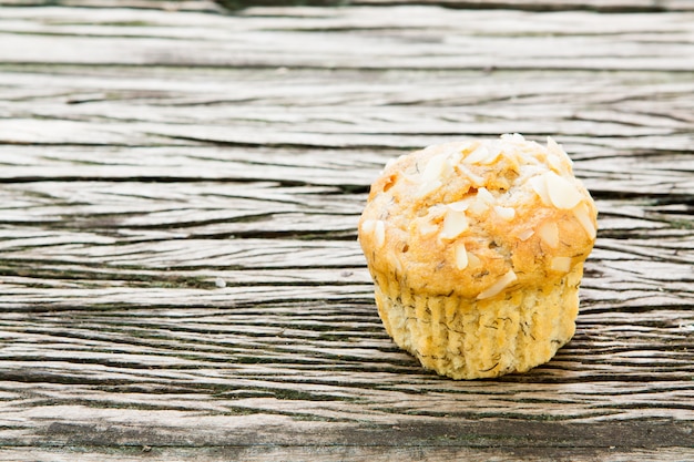 Photo banana cake on wood background.