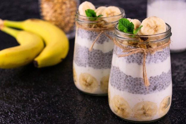Banana Chia Pudding in Jar on Black Background Concept Healthy Snacks