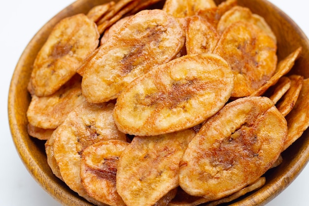 Banana chips on white background