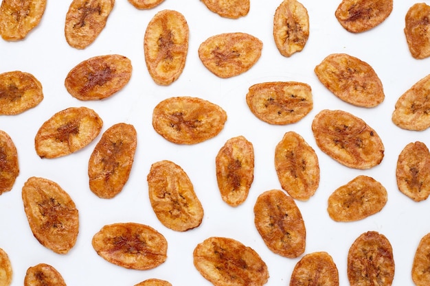 Banana chips on white background