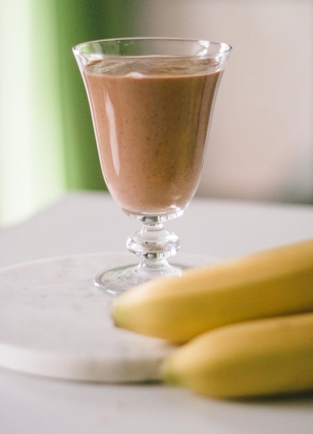 Banana cocoa smoothie healthy eating recipe styled concept