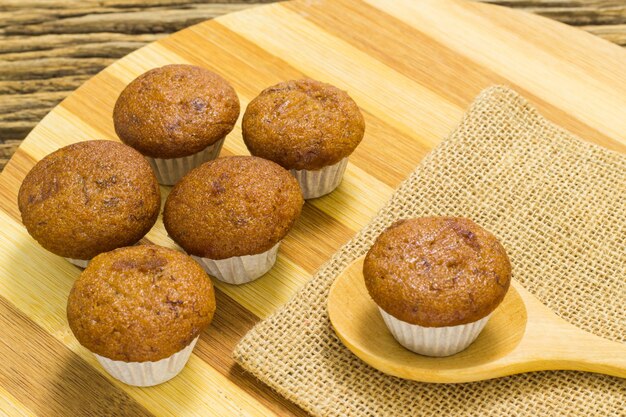 Banana cup cake on wooden background