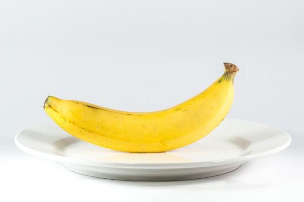 Banana on dish diet meal clean food concept