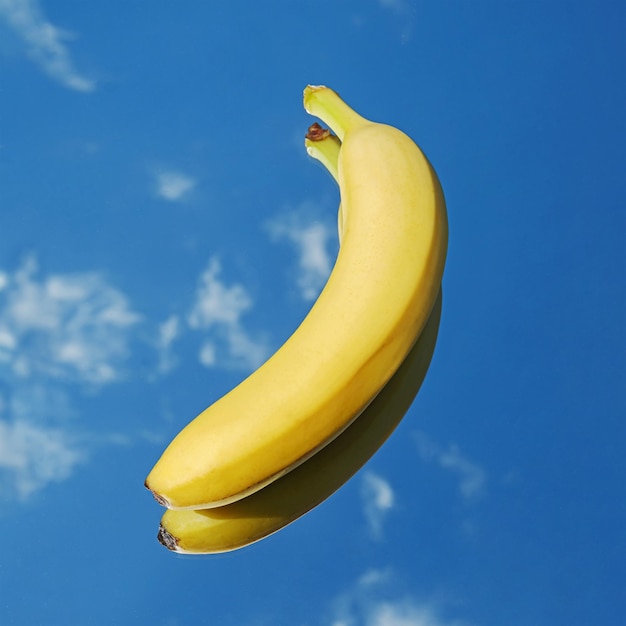 Banana fruit tropical yellow on blue sky and clouds background