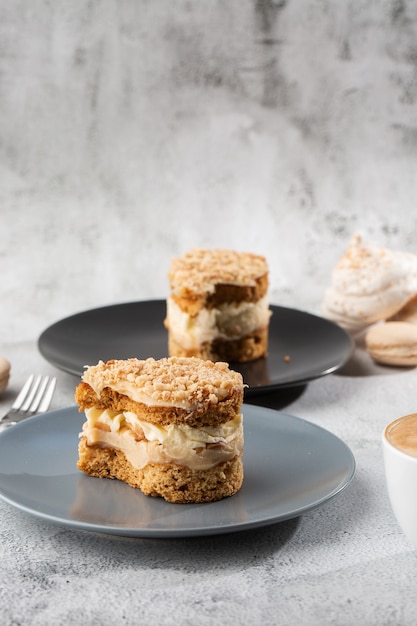 Banana or nut cake on gray plate on marble background. Selective focus. Vertical photo. Menu for bakery. cafe menu. Pastry. Delicious and sweet dessert at cafe restaurant.