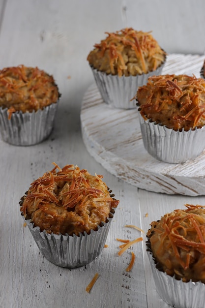 Banana oat muffins topping with grated cheese