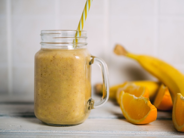 A banana orange smoothie. Healthy milkshake