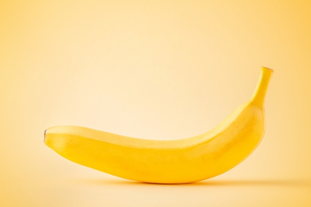 Banana on pastel yellow