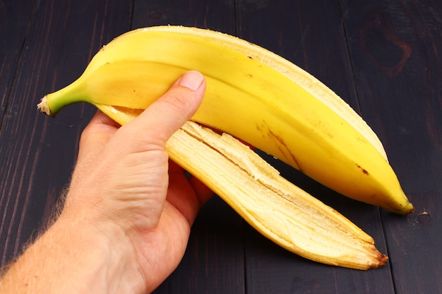 Banana peel in hand close up