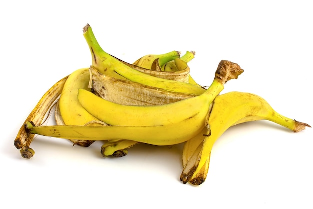 Banana peels isolated on white background Food waste Organic particles for processing into compost Separate waste disposal