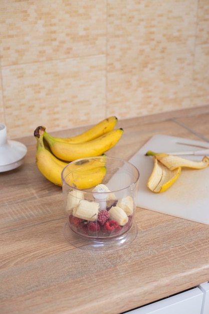 Banana and raspberry smoothie Cooking in the home kitchen