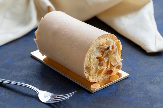 Banana roll cake on blue black background