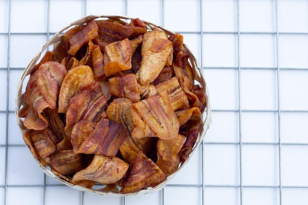 Banana slice chips on white background