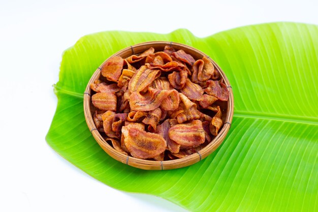 Banana slice chips on white background