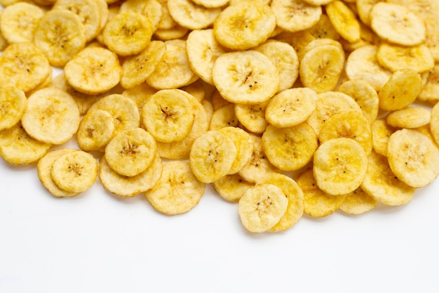 Banana slice chips on white background