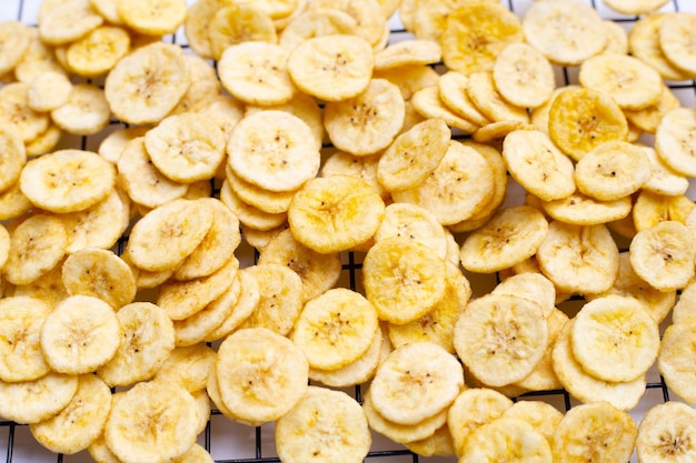 Banana slice chips on white background