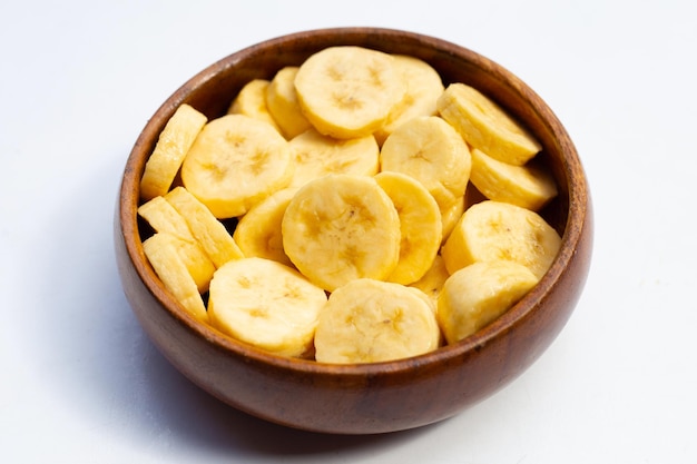 Banana slices in wooden bowl