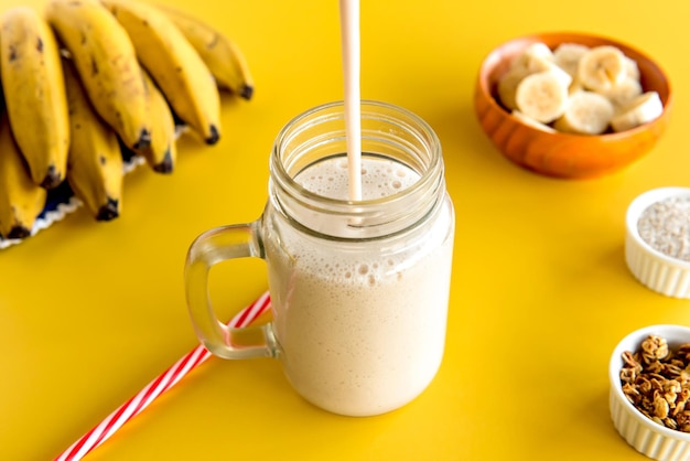 Banana smoothie cup healthy shake of banana with milk