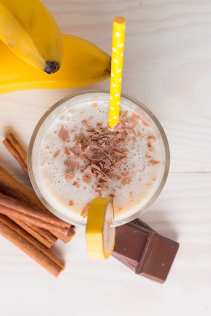 Banana Smoothie on a wooden table. 