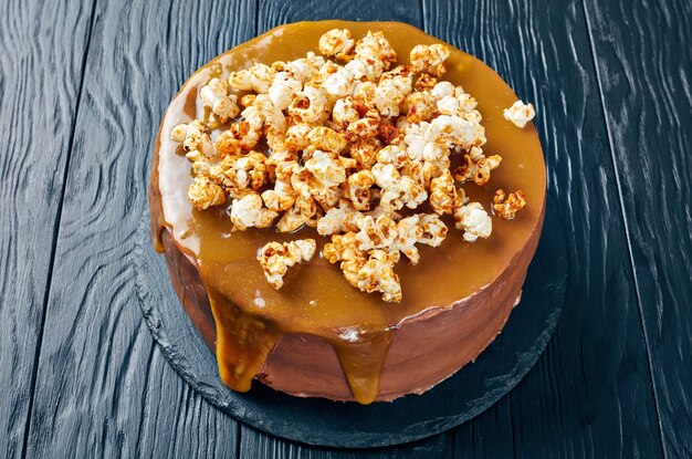 banana sponge cake topped with melted caramel and sweet popcorn