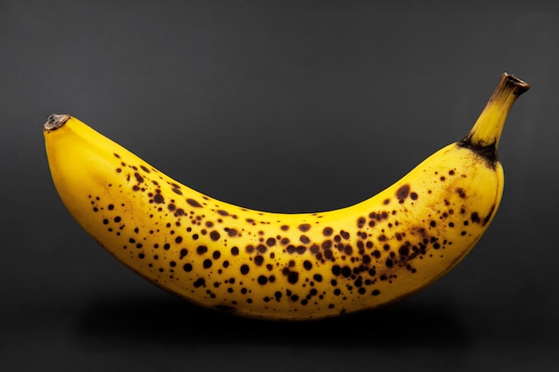 Banana with dark spots. Closeup