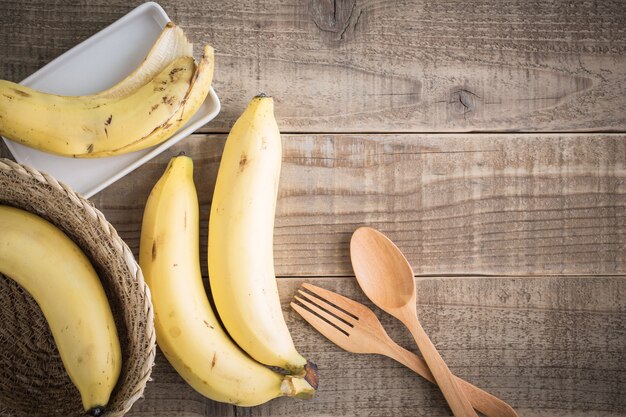 Banana on wooden table, top view