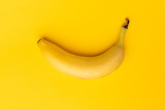 Banana on yellow table.