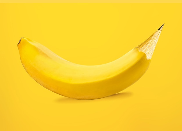 Bananapencil merge creative concept on yellow background