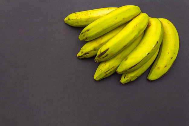 Bananas on black surface